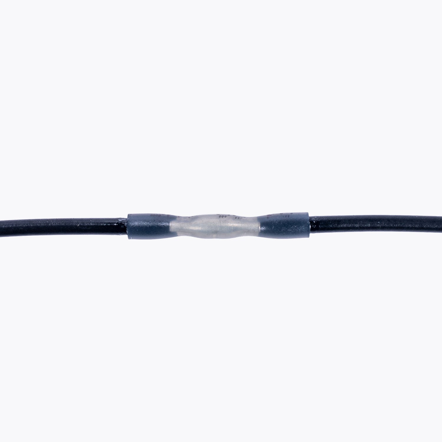 Cable Joiner Butt Splice 2mm white (5 Pack) connecting two black wires, ideal for camping power and LED lighting solutions. Light up your adventures confidently.