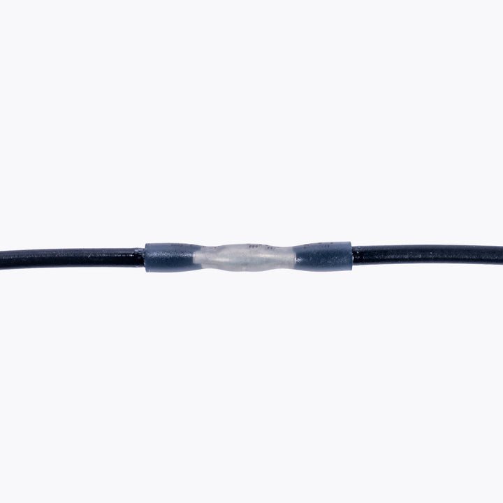 Cable Joiner Butt Splice 2mm white (5 Pack) connecting two black wires, ideal for camping power and LED lighting solutions. Light up your adventures confidently.