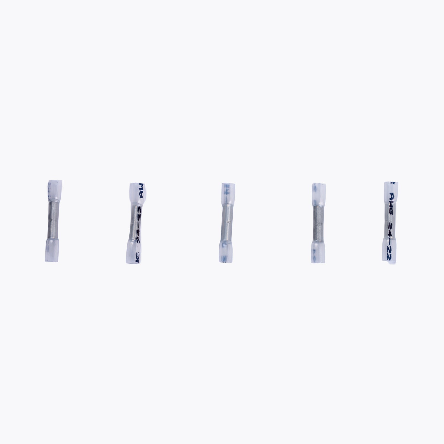 Five Cable Joiner Butt Splice 2mm white (5 Pack) connectors arranged in a row, designed for secure electrical connections in camping power and LED lighting setups.