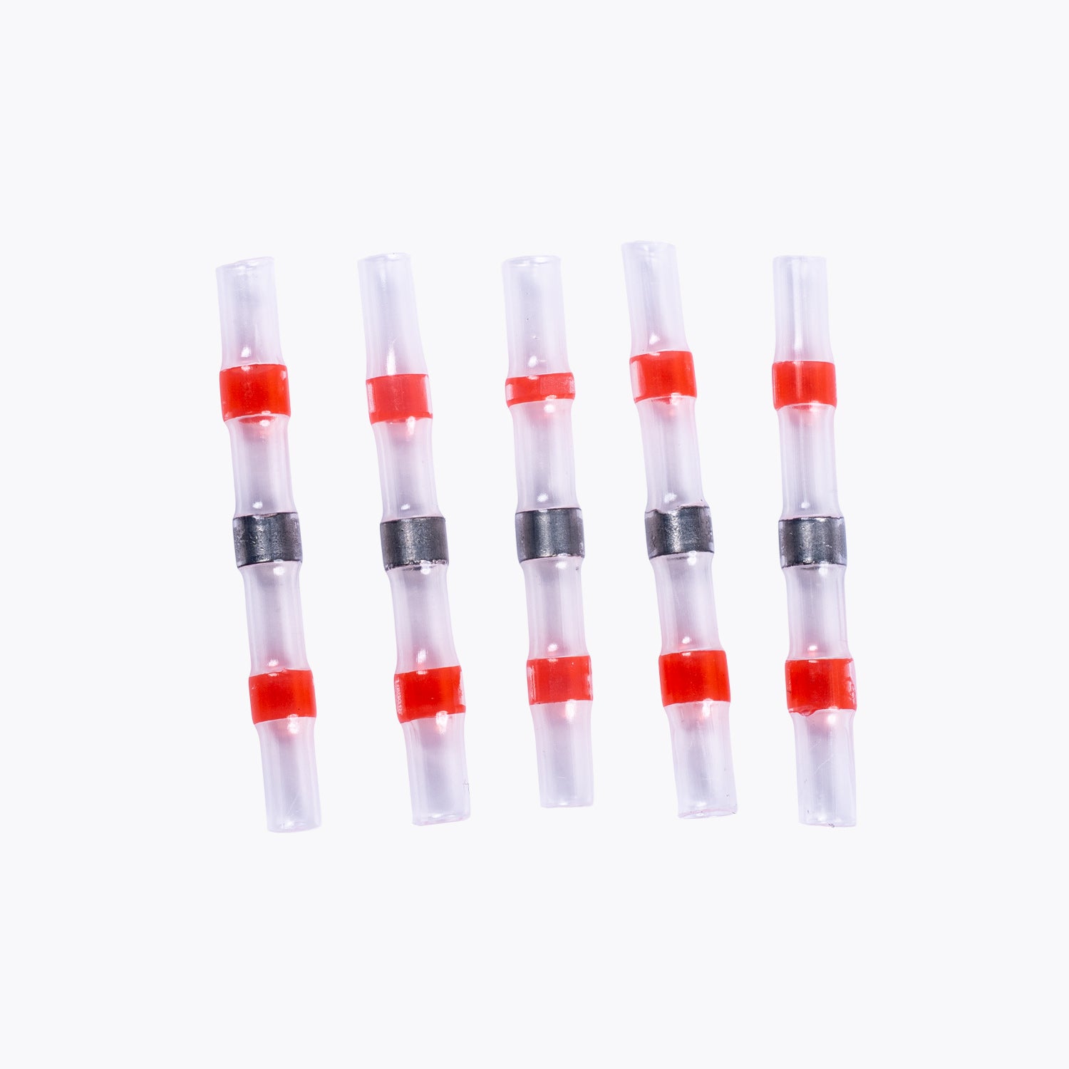 Five red and clear Solder Sleeve Kit - 1.6-2.7mm Red (5 pack) connectors designed for secure electrical wiring, ideal for camping power and LED lighting solutions.