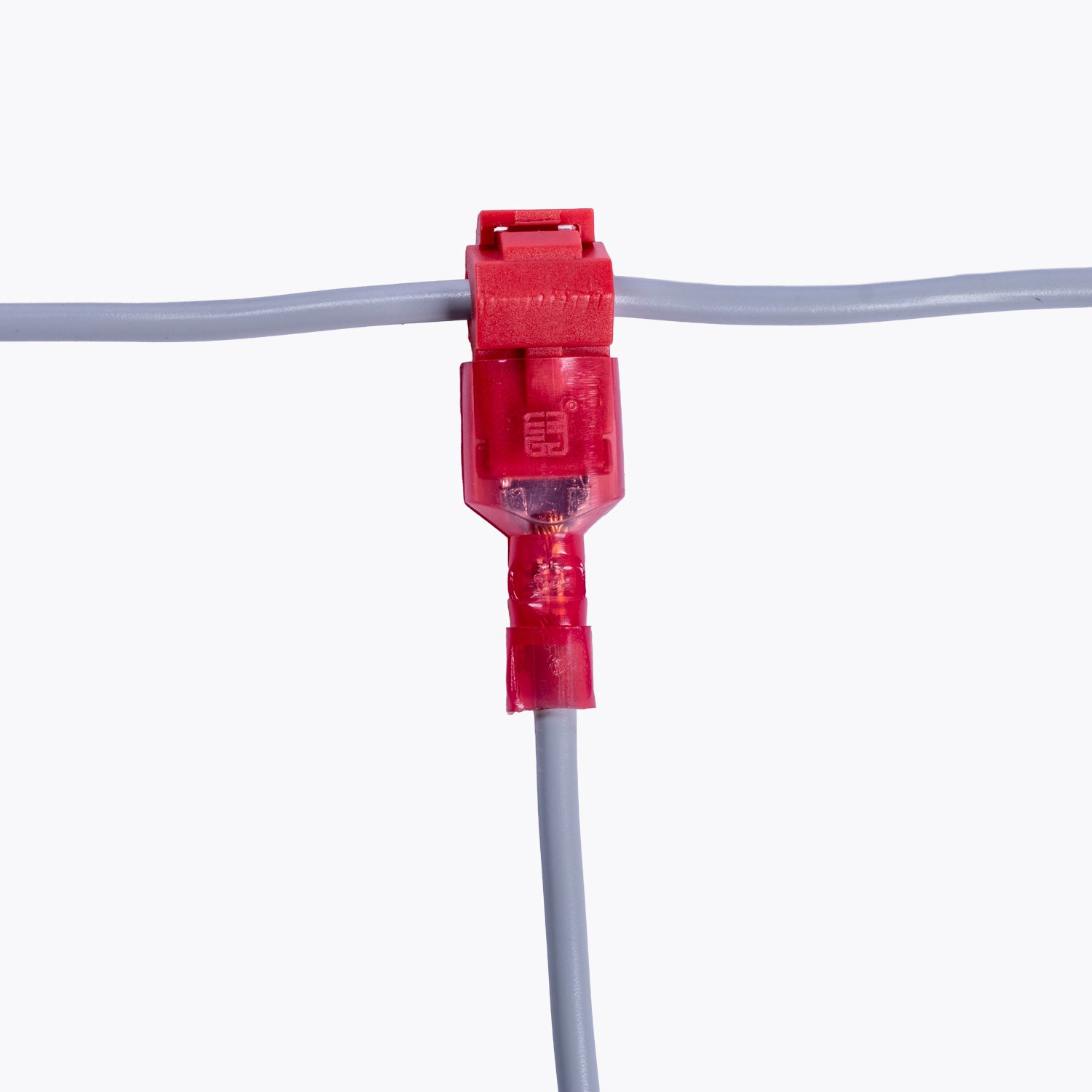 Take Off Connector 3mm Red (6 pack) attached to gray electrical wires, designed for reliable power distribution in camping lights and outdoor LED lighting solutions.