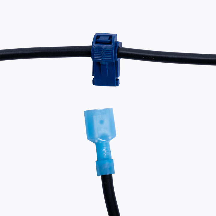Take Off Connector 4mm Blue (6 pack) showing a blue connector clipped onto a black wire and a matching blue insulated terminal ready to connect, ideal for camping power and LED lighting solutions.